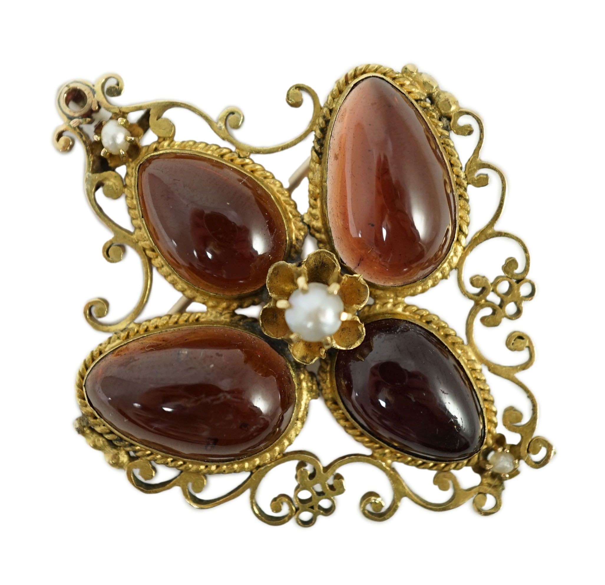 A Victorian gold, four stone garnet and three stone split pearl set mourning pendant brooch
